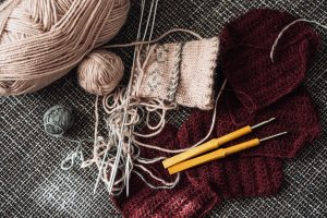 Woolen threads, knitting needles and crochet hooks
